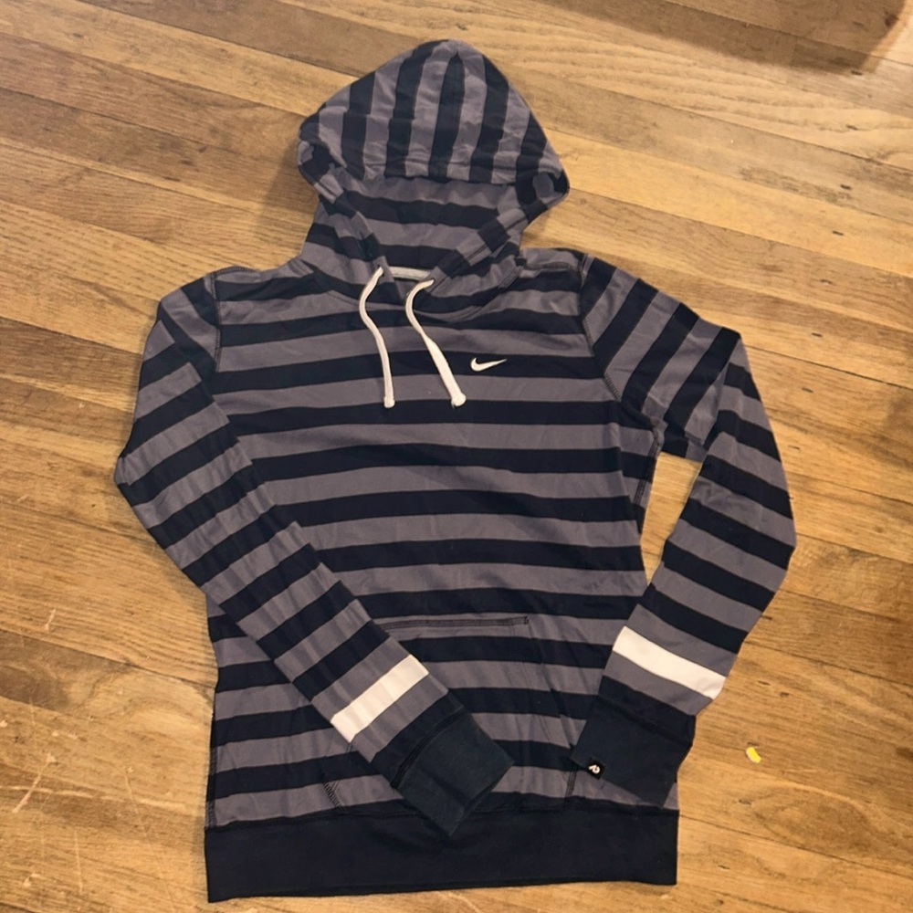 Nike women’s size Large hooded long sleeved shirt.